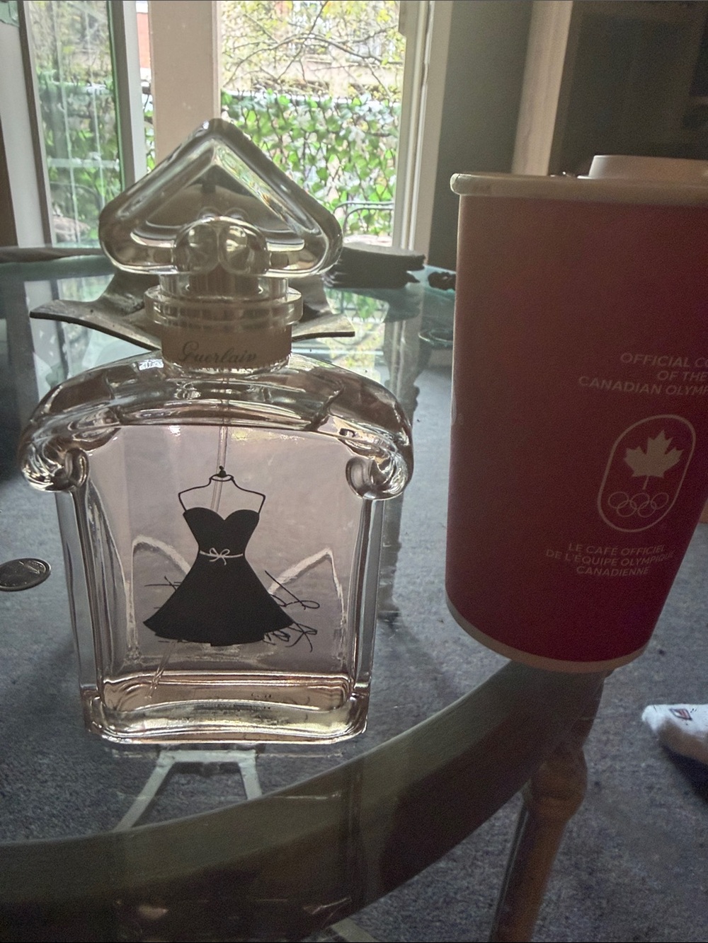 GUERLAIN Clear Glass Bottle with Black Dress Motif